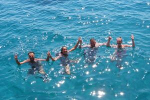 3 Island Cruise Tour in Kos Island with Personalized Audio Guide - Stop 1: Kalymnos dolphin watch and fish-farm views
