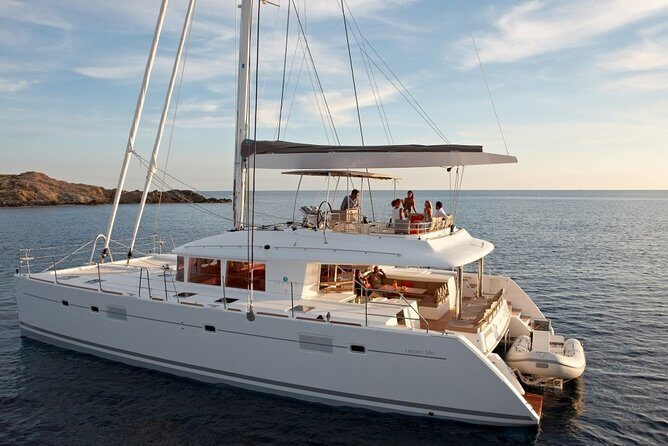 ALL-INCLUSIVE: Santorini Caldera Cruise with Greek Meal & Drinks - Stop 1: Red Beach swim stop (30 minutes, anchored)