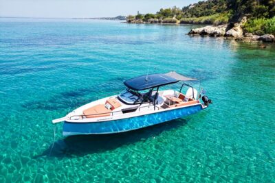 All inclusive VIP Zakynthos Boat Tour to Shipwreck & Blue Caves - Entering the Blue Caves by small boat