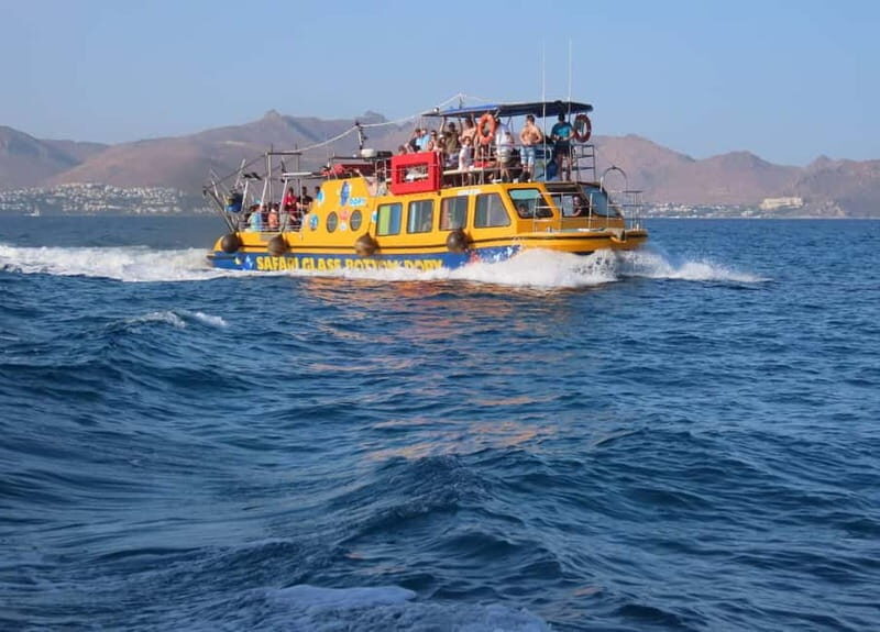 An Aegean Sea Adventure on Glass-Bottom Speedboat Dory! - The Dory boat setup: shade, sun, and sea-floor watching