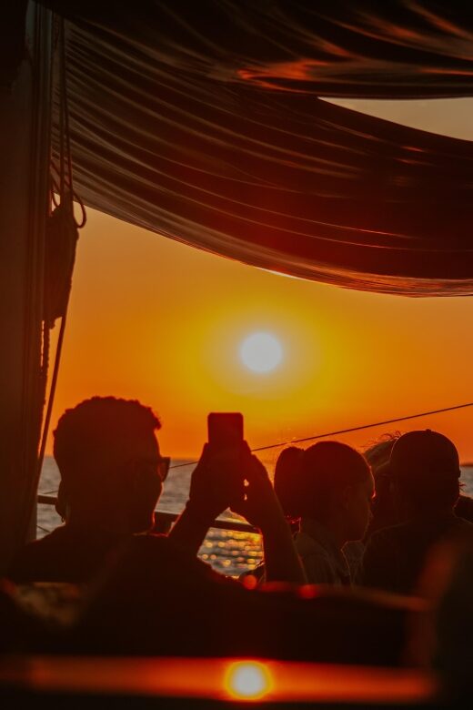 Argostoli: Sunset Cruise with Swim Stops, Dinner, and Wine - Dinner on deck during sunset: moussaka, salad, wine, and coffee
