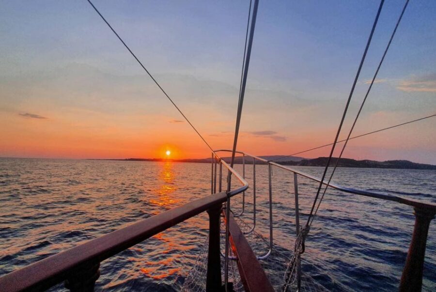Argostoli: Sunset Cruise with Swim Stops, Dinner, and Wine - Paddleboards, snorkel gear, and the “jump off the boat” moment
