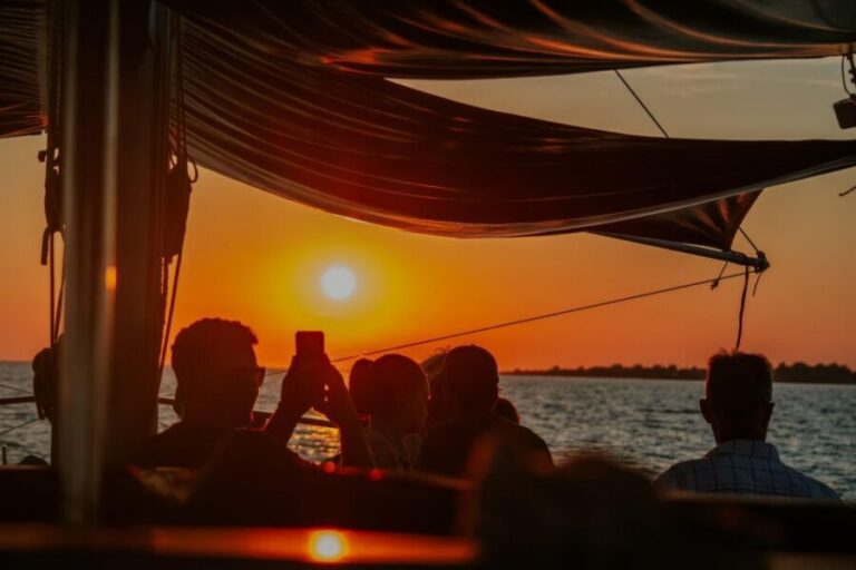 Argostoli: Sunset Cruise with Swim Stops, Dinner, and Wine - The Vardiani (Rabbit Islands) stop: swimming and snorkeling in quiet coves