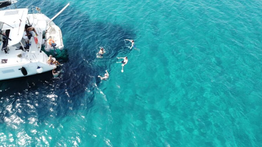Athens: Catamaran Cruise with Fresh Lunch and Wine - Hydroussa islet swim stop: jump-in access and real snorkeling time