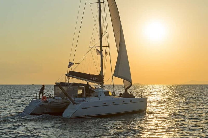 Athens: Half-Day Sunset Catamaran Cruise with Meal & Drinks - Entering the catamaran world: Space, comfort, and a non-party vibe