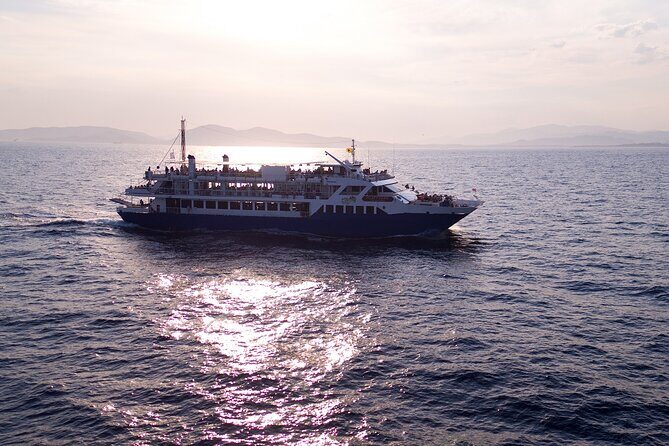 Athens: Island Swimming Day Cruise—DJ, Lunch & Drinks incl. - Metopi Island (Stop 2): uninhabited nature and the slide-and-jump moment