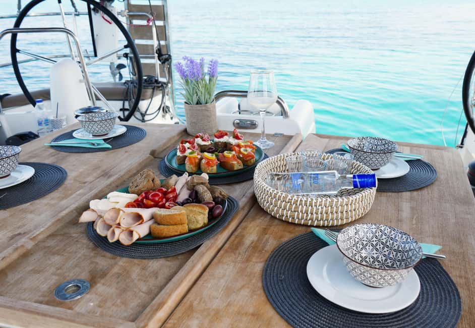 Athens: Semi Private Sunset Sailing and Gastronomy Cruise - The return toward Vouliagmeni and Alimos