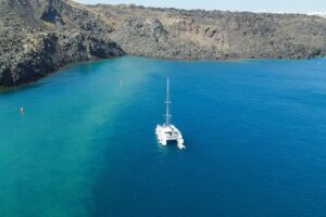 Best of Santorini Private Half-Day Catamaran Cruise with transfer and meal - Red Beach and White Beach: Volcanic Color You Can Swim Into