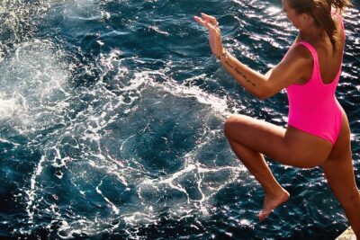 Boat Party with Swimming Stop Experience in Mykonos - A swim stop near Rhenia Island