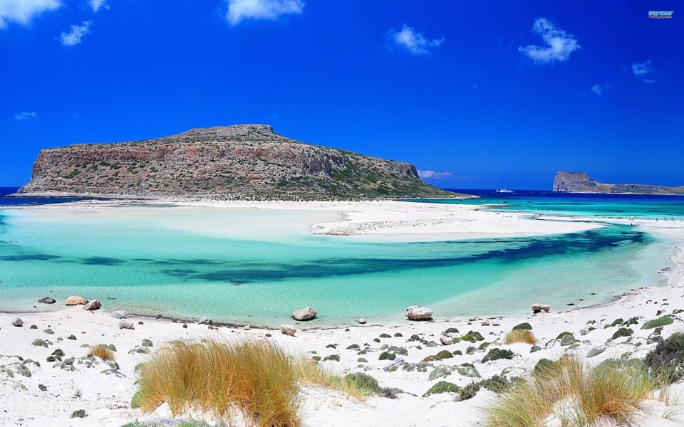 Chania & Reth: Balos with Guide and Transfer - Sun, umbrellas, and the practical beach experience
