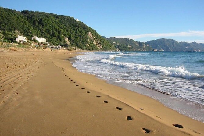 Corfu: A relaxed day at Glyfada Beach - Sunbeds, umbrellas, and beach-club comfort