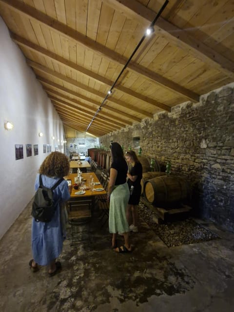 Corfu: Olive Oil & Wine Tastings & Traditional Villages Tour - Paleokastritsa from a high coastal viewpoint