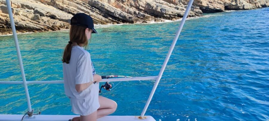 Crete: Fishing & Swimming Boat Cruise with Lunch & Drinks - Swim stops and snorkeling near sea caves: the best part for most people