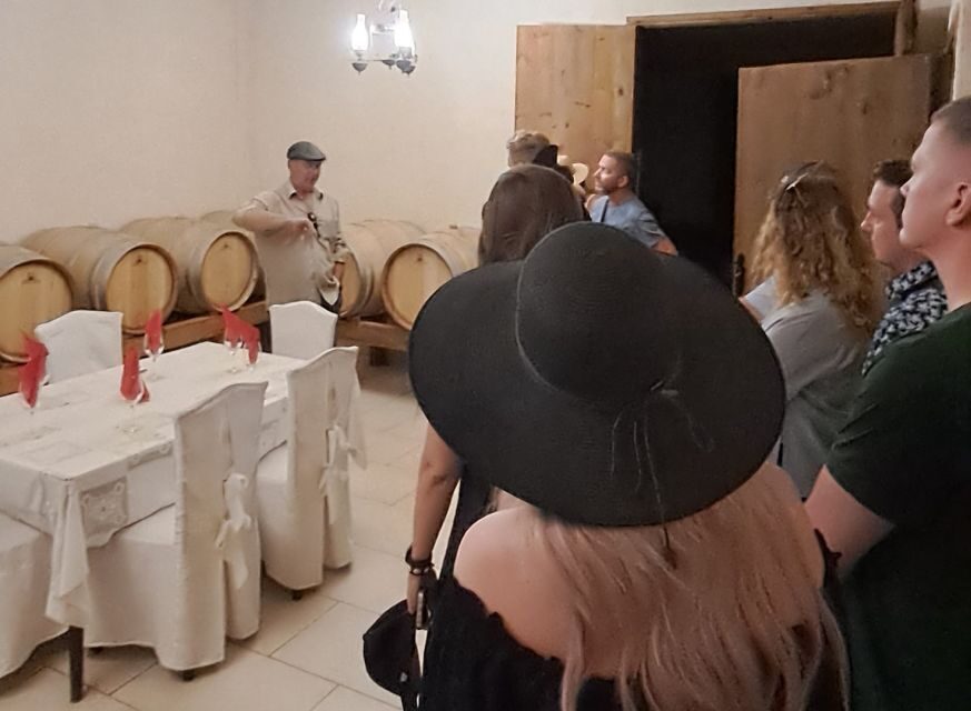Crete: Full-Day Cretan Wines, Olive Oil, Raki and Food Tour - Raki distillery stop: spirits, an ancient wine press, and real Cretan habits