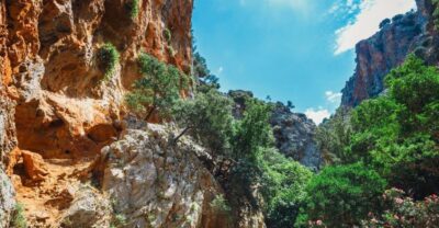 Crete: Kritsa Gorge Hike with Picnic & Swim Stop - Views between cliffs and canyon walls