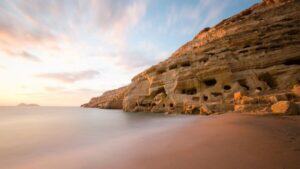 Crete: Matala Beach and Hippie caves, Red beach - Hippie caves and the 1960s story you can walk through