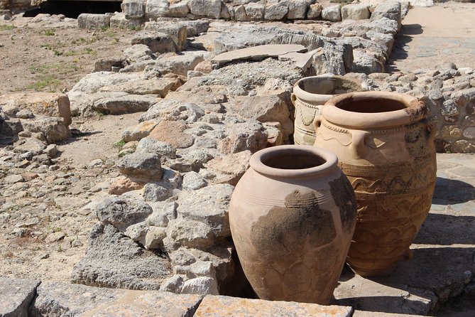 Crete Minoan Discovery Tour with Knossos Palace, Heraklion, and Live Dance Show - Walking through the vast Palace of Knossos