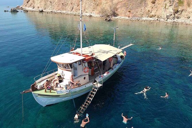 Cruise to White Rocks & Xi Beach with lunch and wine - Stop 3: Mania Beach (the red-sand clay spot) and the natural spa moment