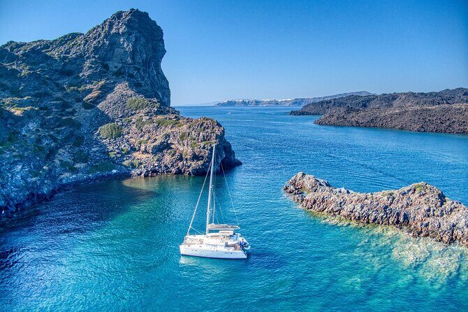 Deluxe Santorini Sailing with BBQ and Drinks Shared Tour - Sailing by the Lighthouse and Indian Head Mountain: the coast views you can’t fake