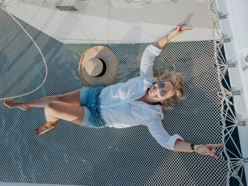 Dia Island Catamaran – Premium Lunch, Open Bar, Small Group - Dia Island swim bay: snorkeling, SUP, fishing, and the flamingo float