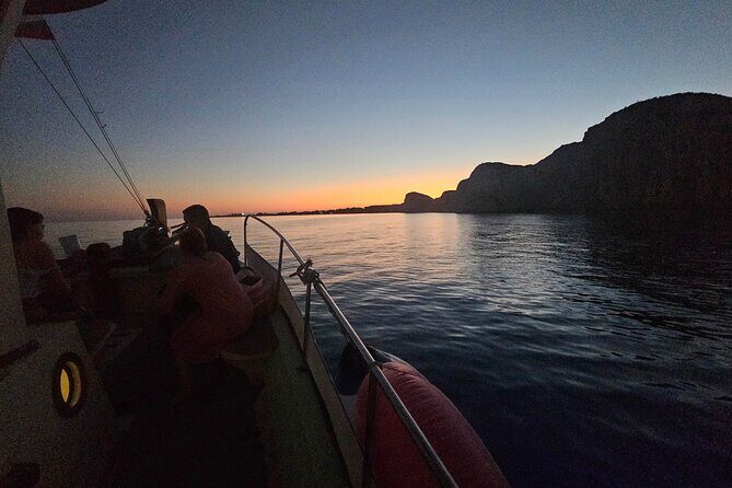 Dreamy Cruise sunset tour with dinner and unlimited wine! - Stop 2: Xi Beach After Sunset for Night Swimming (40 Minutes)