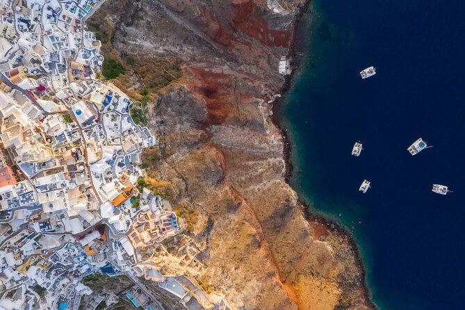 Experience Santorini Sunset by Helicopter - Fira on the caldera edge