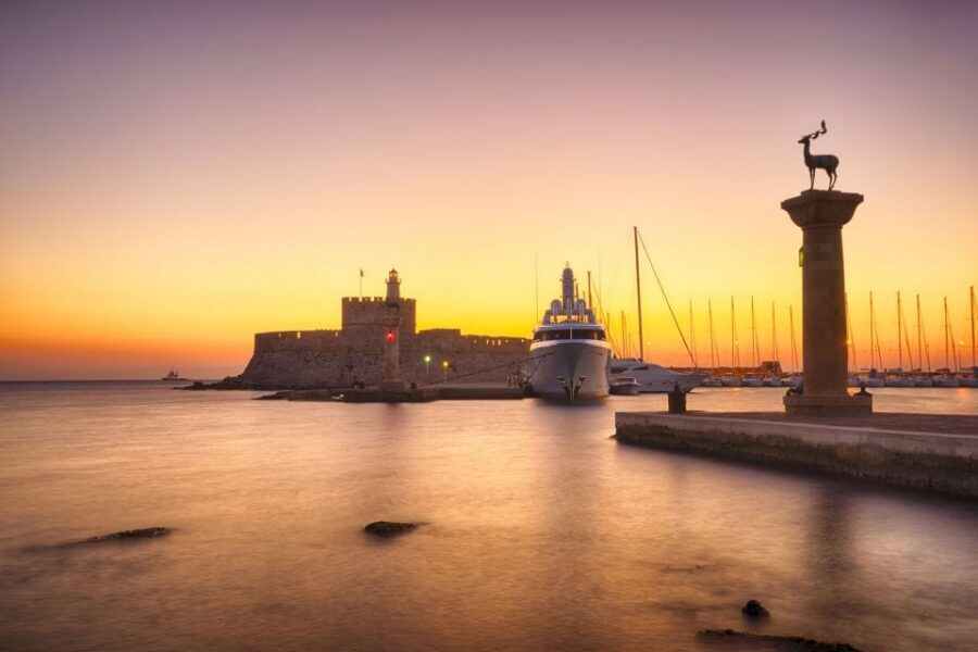 Faliraki: Evening RIB Cruise with Champagne and Sunset Views - Entering the harbor scene fast from Faliraki