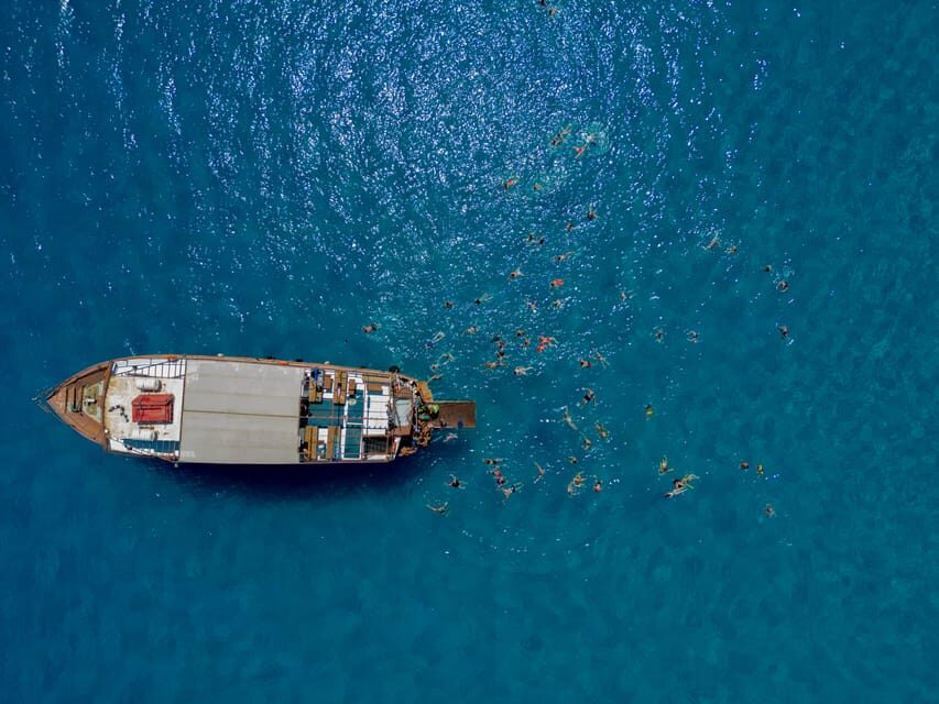 Faliraki : Transfer & Cruise to Lindos with 3 Swimming Stops - Navarone Bay stop: quick swim time with snorkel potential
