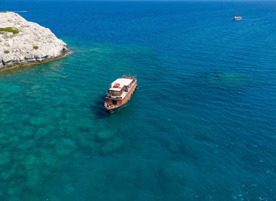 Faliraki : Transfer & Cruise to Lindos with 3 Swimming Stops - Onboard cruising: what the bar adds (and what it doesn’t)
