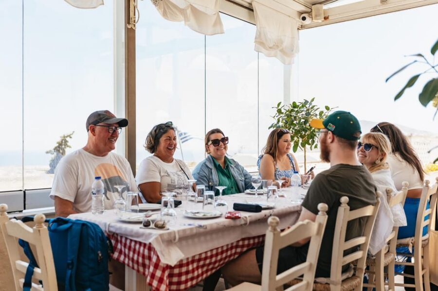 Fira: Guided Foodie Walking Tour with Tastings - Daily market stop: fish and vegetables that explain the menu