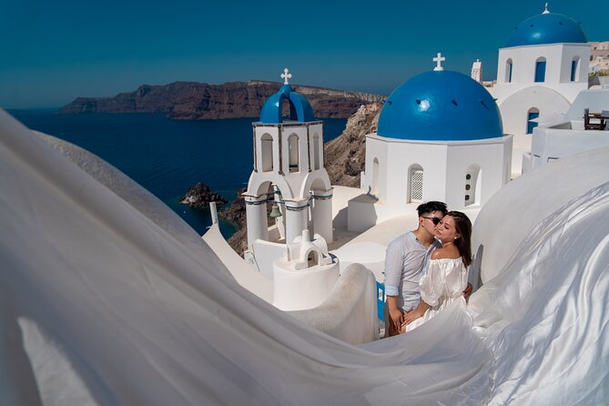 Flying Dress Photoshoot in Oia Private entry to Blue Dome - The dress and the assistant