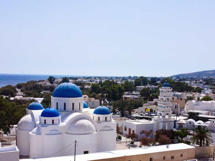 From Fira: Santorini Highlights Minibus Tour with Oia Sunset - The old lighthouse stop and Red Beach: volcanic drama on a schedule