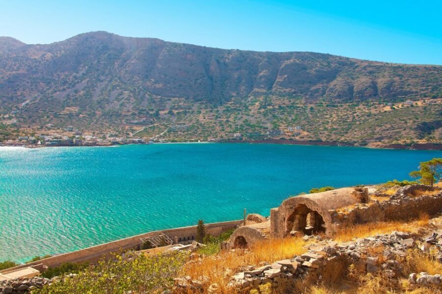 From Heraklion: Elounda and Spinalonga Full-Day Tour - Agios Nikolaos and the Bottomless Lake: Shops, Coffee, and an Easy Stroll