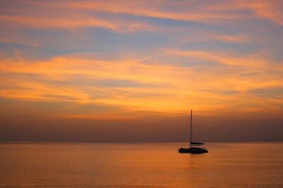 From Mykonos: Small Group Delos and Rhenia Catamaran Tour - Passing Delos, the sacred island of Apollo and Artemis