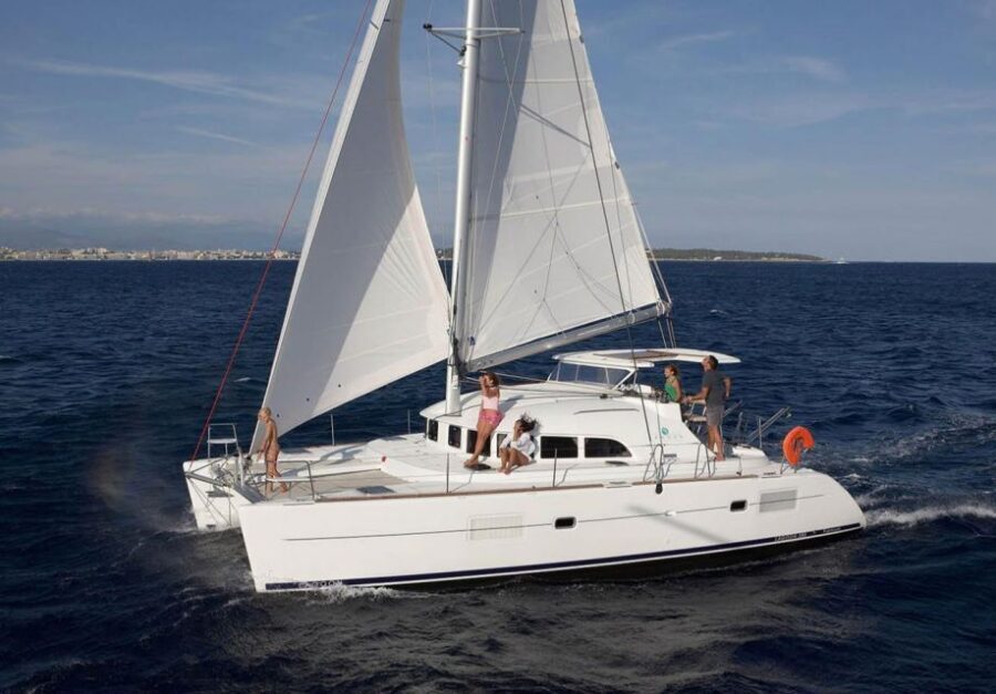 From Ornos: Mykonos Delos Catamaran Cruise with Meal & SUP - Rhenia Island: the real star for swimming and snorkeling