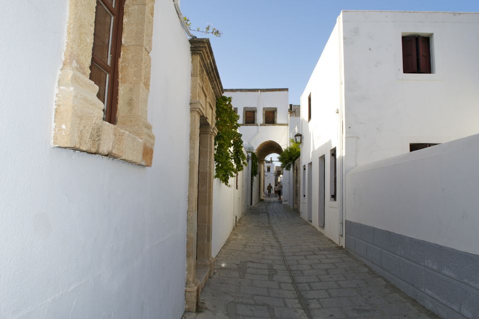 From Rhodes: Lindos Village and Acropolis Guided Tour - Walking through the whitewashed village