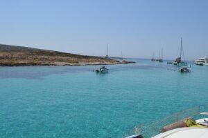 Full Day Catamaran Cruise in Paros - Stop 1: Antiparos Blue Lagoon (Panterinosia) for clear-water swimming