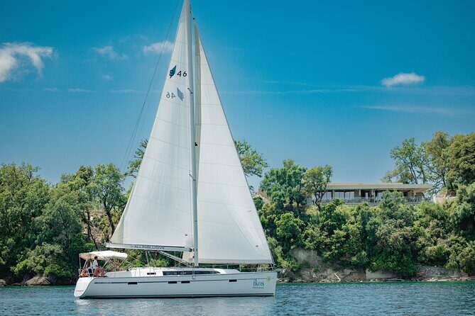 Full Day Cruise on Sailing Yacht in Corfu Island - Strogylo Beach: cobblestones, clear water, and a long first swim