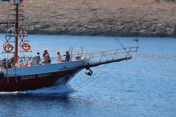 Full Day Kos Guided Boat Tour Including Lunch - Plati, clear water beside a tiny church