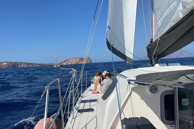 Full Day Tour to Kleftiko, Firlingos and Poliegos Catamaran - Gerakas shows Milos in white