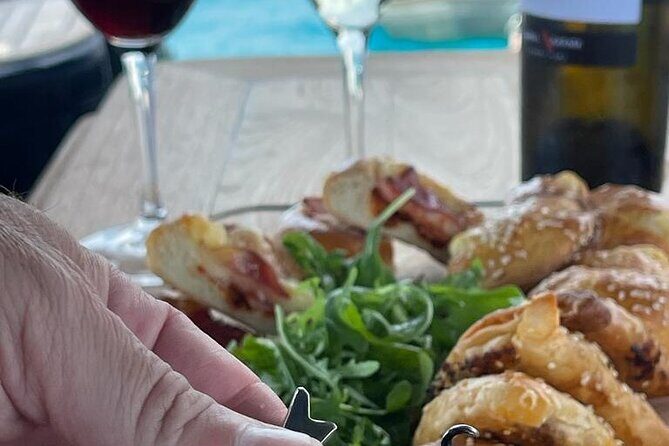 Greek Gastronomy & Wine Pairing Cruise with a Sommelier in Athens - Onboard chef cooking: what the Greek menu is really like