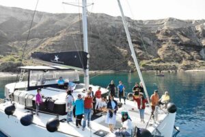 Half-Day Exclusive Catamaran Cruise in Santorini with Meal and Open Bar - Santorini volcano and hot springs: your warm-water reality check