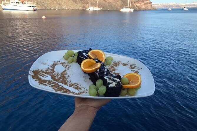Half-Day Tailor-made Private Catamaran Cruise in Santorini - Getting on board in Fira: pickup timing and how the day starts