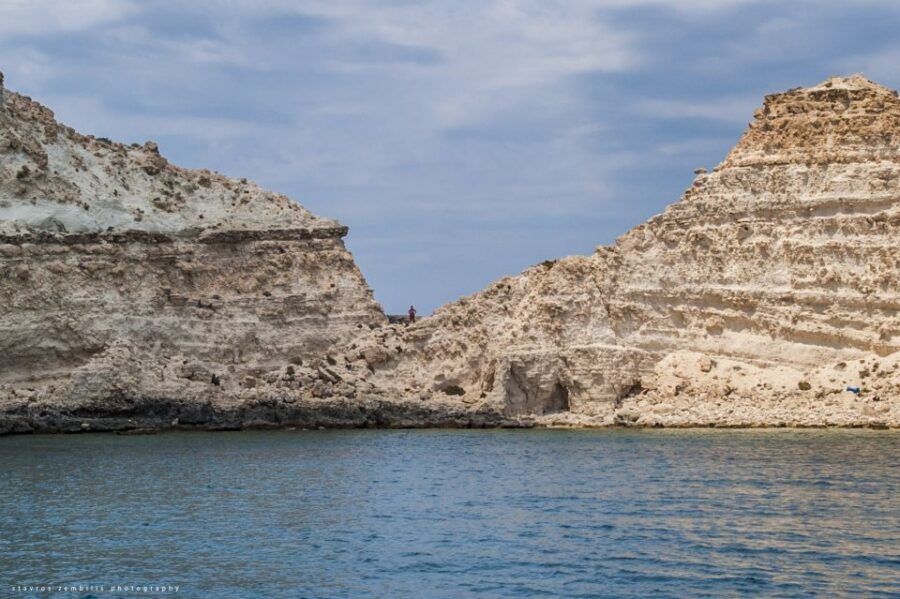 Heraklion, Malia & Agia Pelagi:Boat Trip to Koufonisi Island - Approaching Koufonisi: caves, steep cliffs, and crystal-clear water
