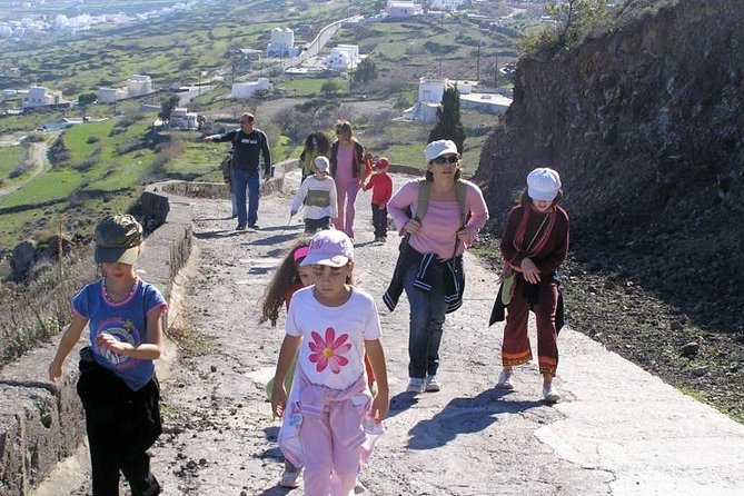 Hiking activity through the volcanic land of wonder - Firostefani’s white houses and deep cliff edge