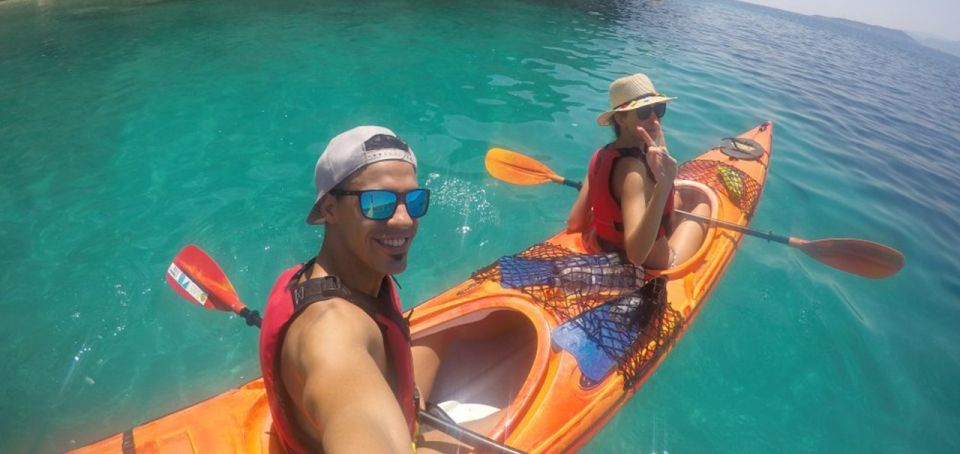 Lefkada: Hidden Blue Cave Kayak Trip with Lunch & Fruits - Snorkeling over large red sea stars
