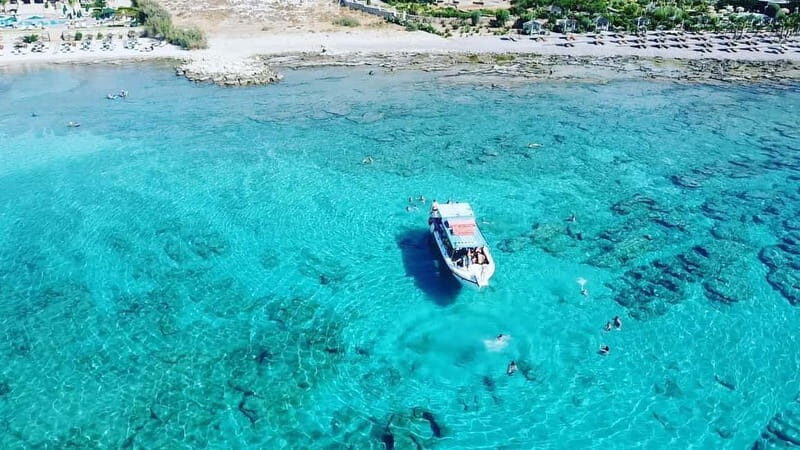 Lindos: Glass Bottom Boat Tour with Snorkeling - The Route From the Water: Cleovoulos Tomb and Lindos Caves