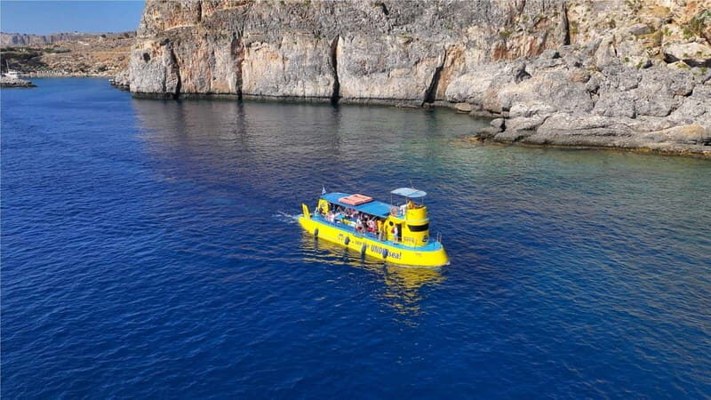 Lindos: Submarine Cruise with Swimming Stop at Navarone Bay - Going below in Hippo Sub: feeding fish and watching reef life from a dry, cooled chamber