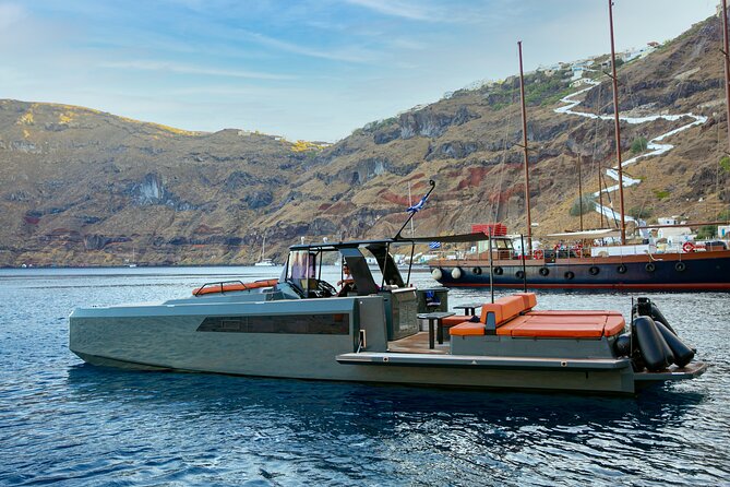 Luxury Private Power Catamaran Tour in Santorini - Swimming, snorkeling, and cliff jumping