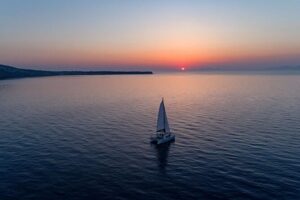 Luxury Sunset Cruise with Swim Stops, BBQ meals and Open Bar - Cruising across the caldera toward Santorini’s volcano sights